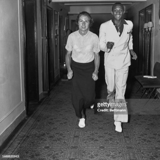 American athletes Helen Stephens and Jesse Owens pictured at the Hotel Lincoln in New York ahead of the US Olympic team's departure for Berlin, July...