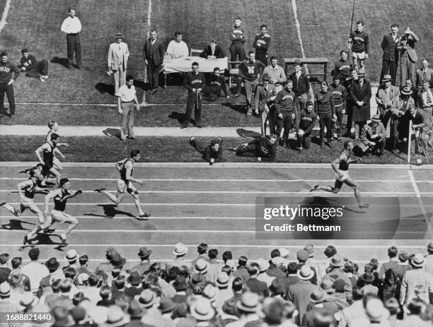 American athlete Jesse Owens has a substantial lead in the 100 yard race during the Quadrangular Meet at Dyche Stadium in Evanston, Illinois, May...