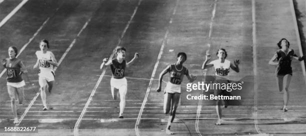 American sprinter Wilma Rudolph winning the women's 100 metre race at the Summer Olympics in Rome, Italy, September 2nd 1960. Left to right:...