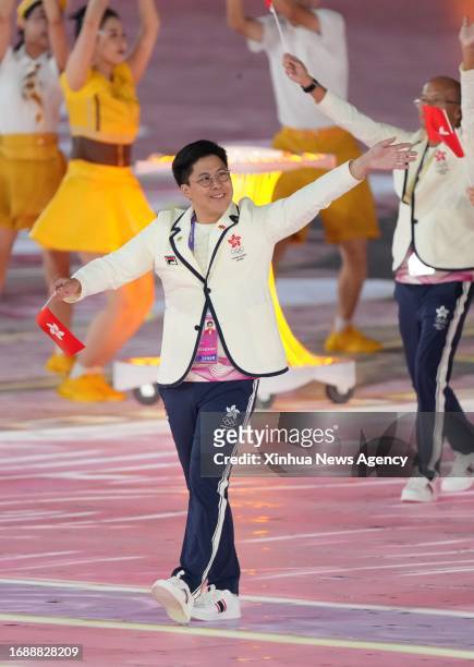 Kenneth Fok Kai-kong of delegation of Hong Kong, China parades into the Hangzhou Olympic Sports Center Stadium during the opening ceremony of the...