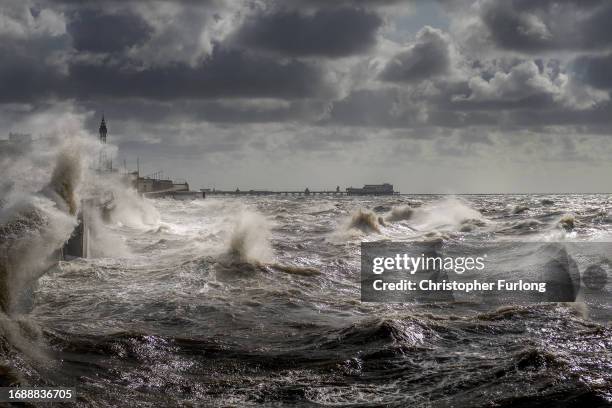 Strong winds and a high tide create large waves that hit the seawall on Blackpool Promenade on September 18, 2023 in Blackpool, United Kingdom. Parts...