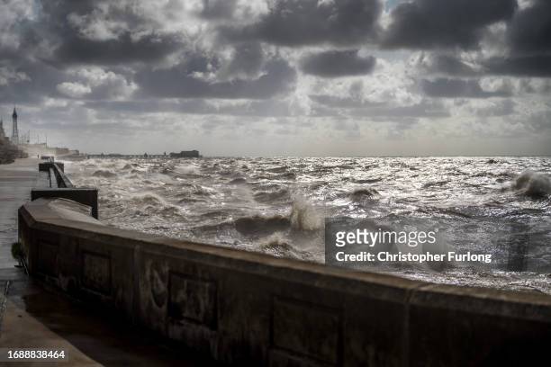 Strong winds and a high tide create large waves that hit the seawall on Blackpool Promenade on September 18, 2023 in Blackpool, United Kingdom. Parts...