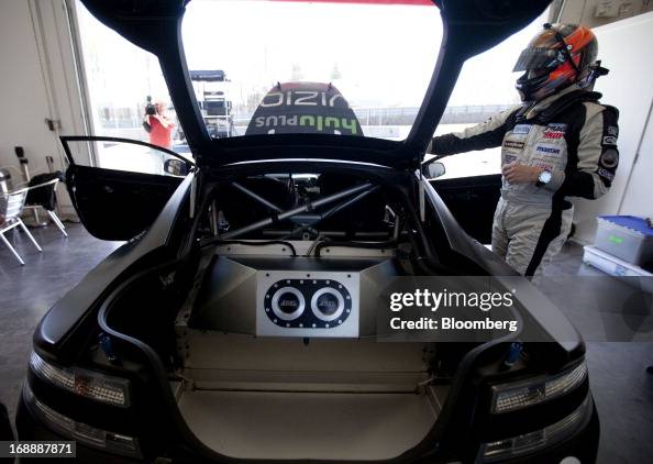Gt4 Rear View The open rear section of an Aston Martin GT4 racecar is displayed at ...