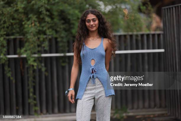 Deba Hekmat aka d.3b4 was seen wearing green dipped pants and a blue top with one hole before Holzweiler Fashion Show during London Fashion Week...