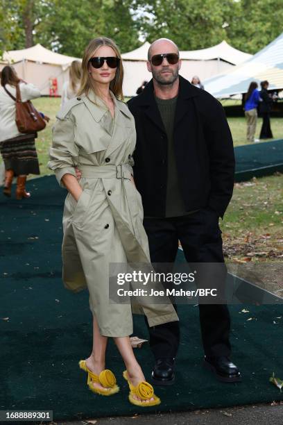 Rosie Huntington-Whiteley and Jason Statham attend the Burberry show during London Fashion Week September 2023 at Highbury Fields on September 18,...