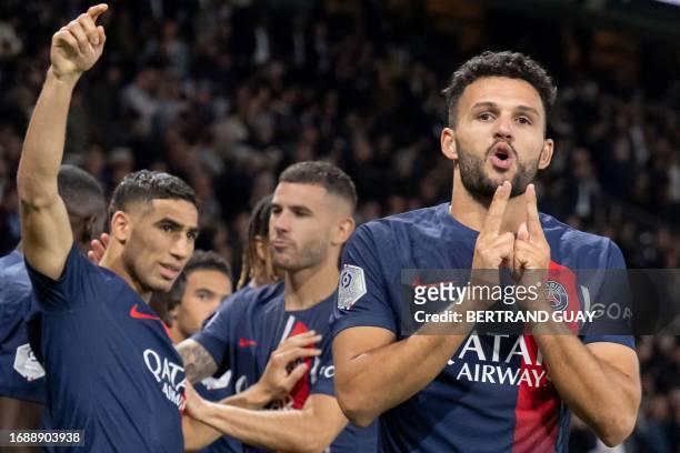 Paris Saint-Germain's Portuguese forward Goncalo Ramos celebrates with team mates after scoring a goal during the French L1 football match between...