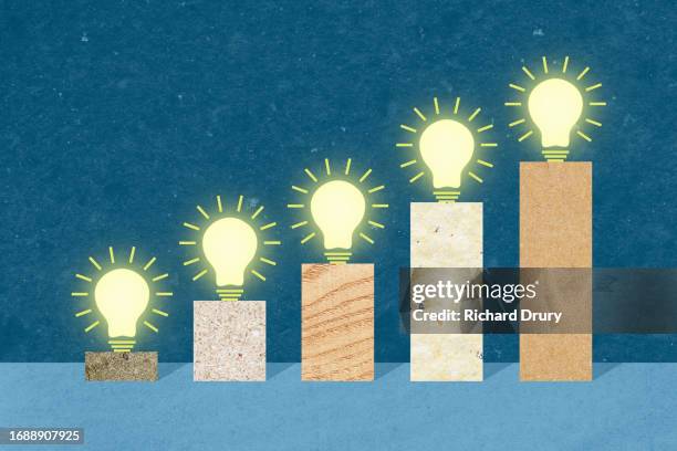 a rising bar graph with lightbulbs - green energy icons stock pictures, royalty-free photos & images