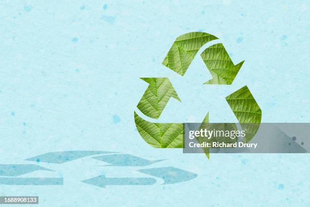 a recycling symbol made of leaves - economy icon stock pictures, royalty-free photos & images