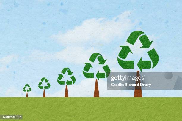 growing trees made of recycling symbols - ethischer konsum stock-fotos und bilder
