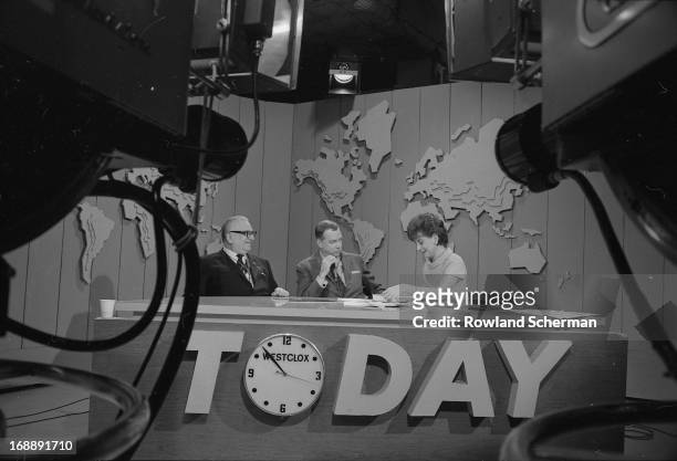 From left, author Harry Golden , and broadcast journalists Hugh Downs and Barbara Walters talk at the desk on the set of the 'Today' show during...