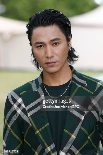 Chen Kun attends the Burberry show during London Fashion Week September 2023 at Highbury Fields on September 18, 2023 in London, England.