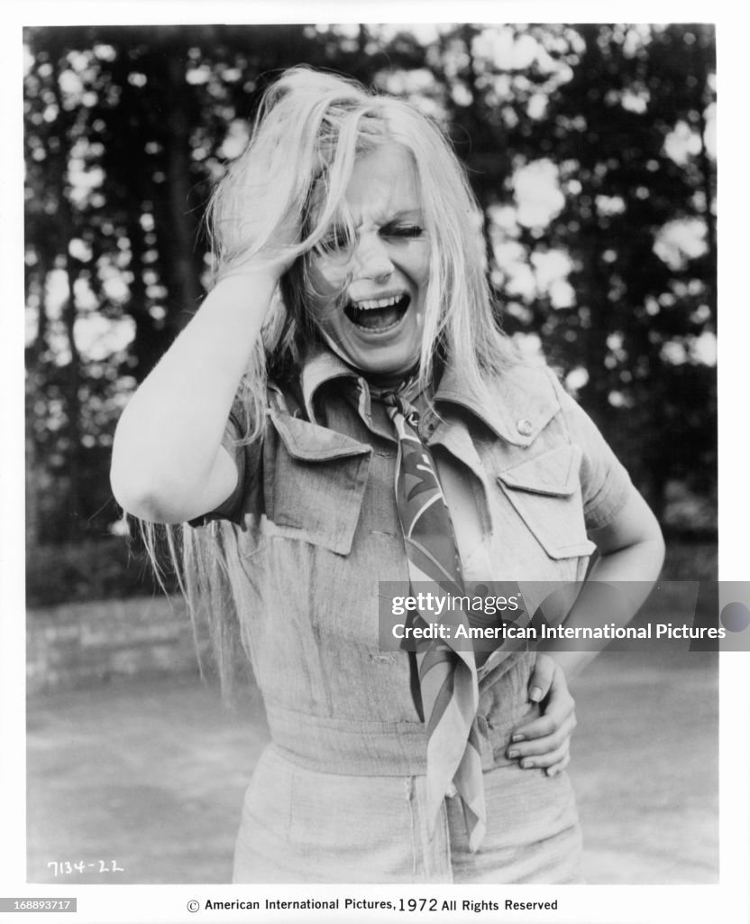 Alexandra Hay holding her head as she screams in a scene from the