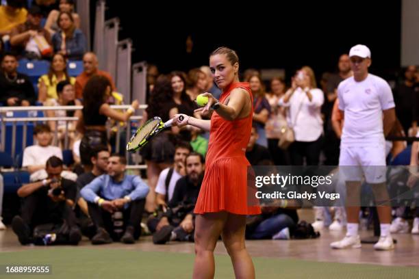 Mónica Puig serves the ball during her Exhibition Match with Venus Williams at Coliseo de Puerto Rico José Miguel Agrelot on September 15, 2023 in...