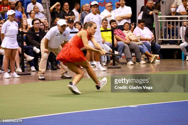 Mónica Puig returns the ball during her Exhibition Match with Venus Williams at Coliseo de Puerto Rico José Miguel Agrelot on September 15, 2023 in...