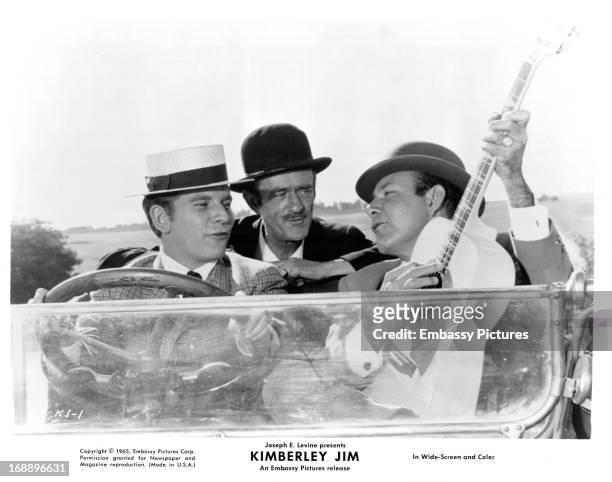 Clive Parnell drives Arthur Swemmer and Jim Reeves in a scene from the film 'Kimberley Jim', 1963.