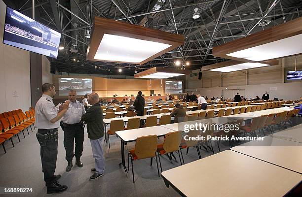 Women who received PIP breast implants wait inside the courthouse with their lawyers at Parc Chanot on May 16, 2013 in Marseille, France. Jean-Claude...