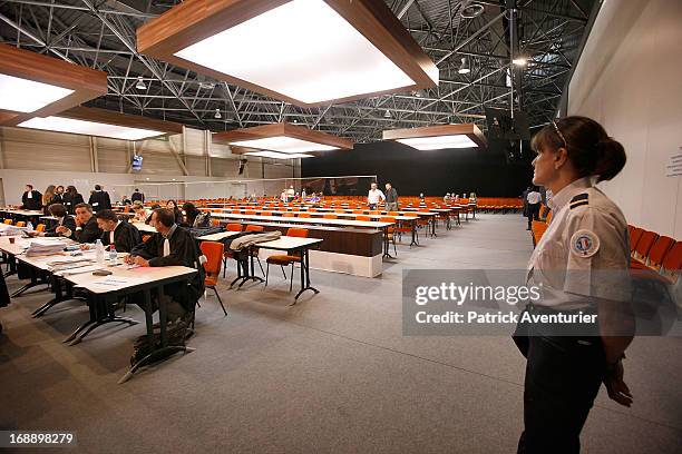 Women who received PIP breast implants wait inside the courthouse with their lawyers at Parc Chanot on May 16, 2013 in Marseille, France. Jean-Claude...