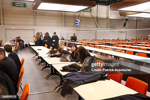 Women who received PIP breast implants wait inside the courthouse with their lawyers at Parc Chanot on May 16, 2013 in Marseille, France. Jean-Claude...