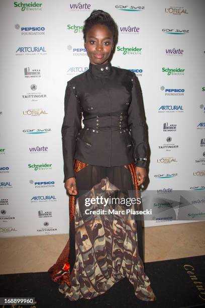 Aissa Maiga attends the 'Planet Finance' dinner photocall at the 'Carlton' hotel during the 66th annual Cannes Film Festival on May 16, 2013 in...