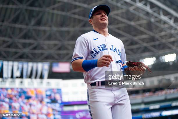 Daulton Varsho of Toronto Blue Jays runs on the field before playing the Boston Red Sox in their MLB game at the Rogers Centre on September 17, 2023...