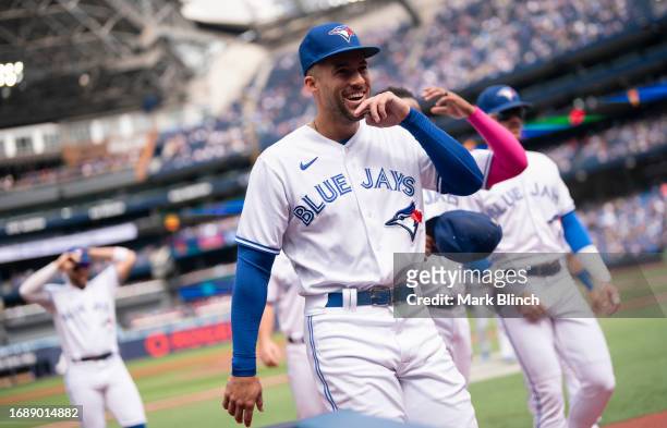 George Springer of Toronto Blue Jays walks to the dugout before playing the Boston Red Sox in their MLB game at the Rogers Centre on September 17,...