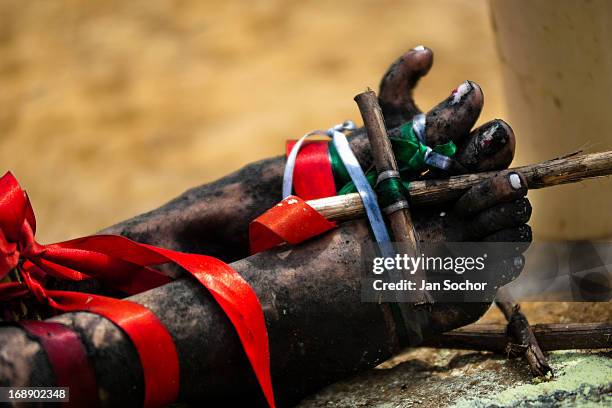 Feet of Diana R., who claims to be possessed by spirits, seen tied with ribbons before a ritual of exorcism performed by Hermes Cifuentes 28 May 2012...