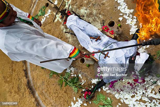 Hermes Cifuentes, a Colombian spiritual healer, performs a ritual of exorcism on Diana R., who claims to be possessed by spirits, on 28 May 2012 in...