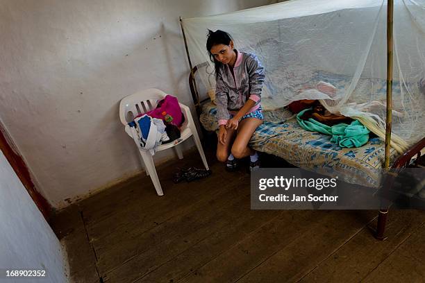 Diana R., who claims to be possessed by spirits, prepares herself for a ritual of exorcism performed by Hermes Cifuentes on 28 May 2012 in La Cumbre,...