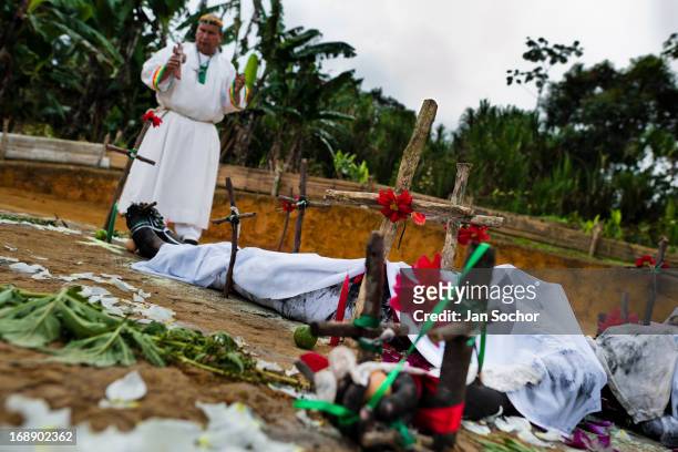 Hermes Cifuentes, a Colombian spiritual healer, performs a ritual of exorcism on Diana R., who claims to be possessed by spirits, on 28 May 2012 in...