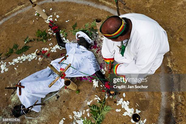Hermes Cifuentes, a Colombian spiritual healer, performs a ritual of exorcism on Diana R., who claims to be possessed by spirits, on 28 May 2012 in...