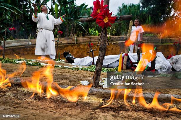 Hermes Cifuentes, a Colombian spiritual healer, performs a ritual of exorcism on Diana R., who claims to be possessed by spirits, on 28 May 2012 in...