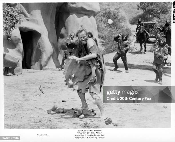 Charlton Heston is pelted with tomatoes by apes in a scene from the film 'Planet Of The Apes', 1968.