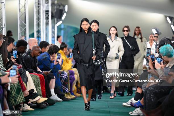 Model walk the runway at the Burberry show during London Fashion Week September 2023 at on September 18, 2023 in London, England.