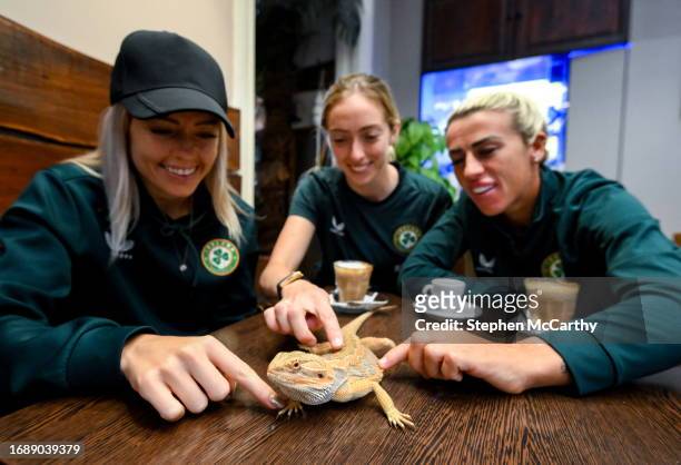 Budapest , Hungary - 25 September 2023; Republic of Ireland players, from left, Denise O'Sullivan, Megan Connolly and Savannah McCarthy with a...