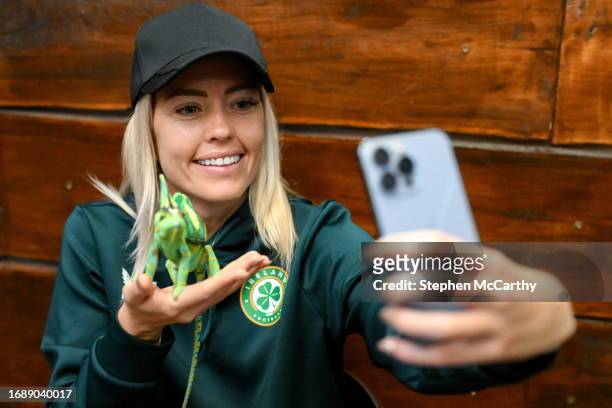 Budapest , Hungary - 25 September 2023; Republic of Ireland's Denise O'Sullivan with Flash, a chameleon, at Zoo Café in Budapest, Hungary, during...