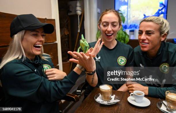Budapest , Hungary - 25 September 2023; Republic of Ireland players, from left, Denise O'Sullivan, Megan Connolly and Savannah McCarthy with Flash, a...