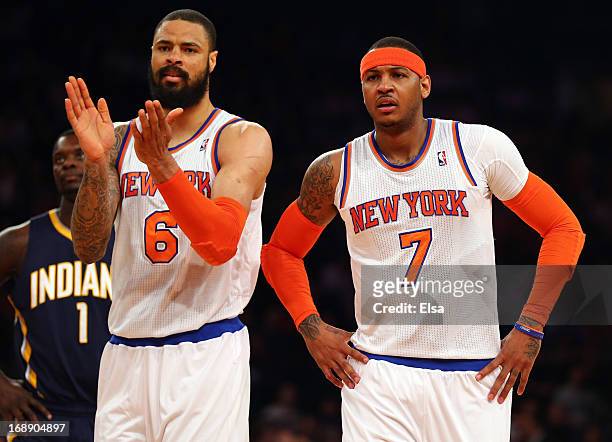 Tyson Chandler of the New York Knicks and Carmelo Anthony react after a play against Indiana Pacers during Game Five of the Eastern Conference...