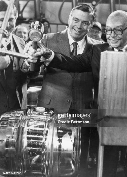 August Busch Jr. , retired chairman of Anheuser-Busch Inc., helps his son, company chairman August Busch III, seal a special keg of beer. The...