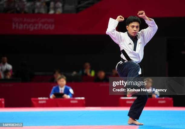 Tran Ho Duy of Vietnam competes during Men's Individual Poomsae Contest of Taekwondo at the 19th Asian Games in Hangzhou, east China's Zhejiang...