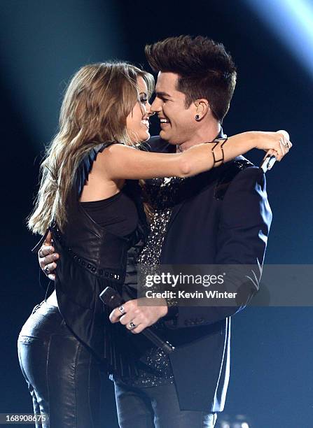 Singers Angie Miller and Adam Lambert perform onstage during Fox's "American Idol 2013" Finale Results Show at Nokia Theatre L.A. Live on May 16,...