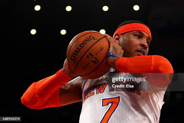 Carmelo Anthony of the New York Knicks rebounds the ball against the Indiana Pacers during Game Five of the Eastern Conference Semifinals of the 2013...