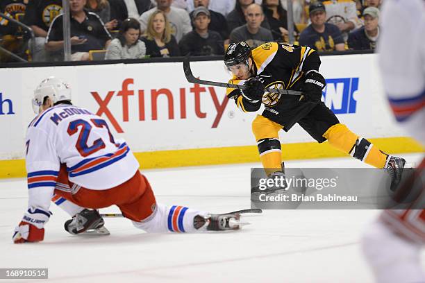 David Krjeci of the Boston Bruins shoots the puck against Ryan McDonagh of the New York Rangers in Game One of the Eastern Conference Semifinals...