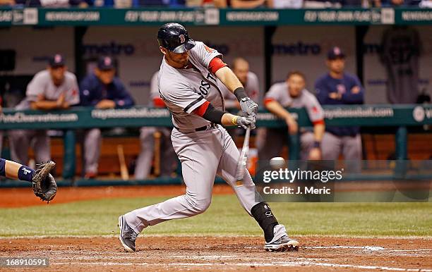 Infielder Will Middlebrooks of the Boston Red Sox hits a bases loaded double in the ninth inning to clear the bases against the Tampa Bay Rays at...