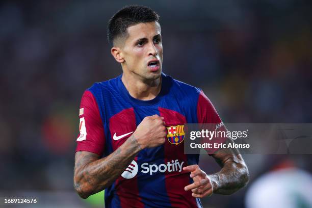 Joao Cancelo of FC Barcelona celebrates after scoring the team's fifth goal during the LaLiga EA Sports match between FC Barcelona and Real Betis at...