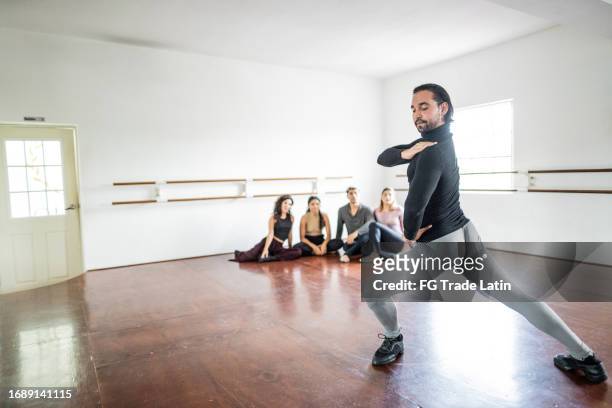 mid adult man dancing at dance studio - jazz dancing stock pictures, royalty-free photos & images