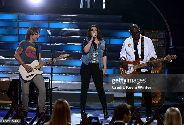 American Idol judge Keith Urban, Finalist Kree Harrison and American Idol judge Randy Jackson perform onstage during Fox's "American Idol 2013"...