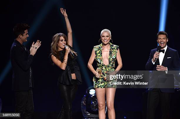 Singers Adam Lambert, Angie Miller,Jessie J and host Ryan Seacrest speak onstage during Fox's "American Idol 2013" Finale Results Show at Nokia...
