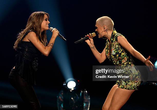 American Idol finalist Angie Miller and singer Jessie J perform onstage during Fox's "American Idol 2013" Finale Results Show at Nokia Theatre L.A....