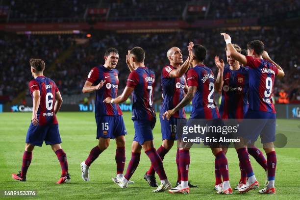 Robert Lewandowski of FC Barcelona celebrates with his teammates after scoring the team's second goal during the LaLiga EA Sports match between FC...