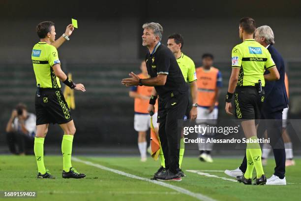 Marco Baroni, Head Coach of Hellas Verona is shown a yellow card during the Serie A TIM match between Hellas Verona FC and Bologna FC at Stadio...